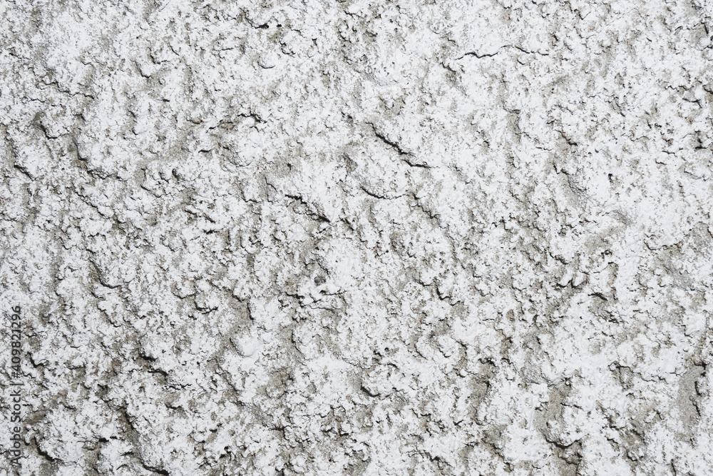 Stucco wall texture. White concrete surface background. Gray plaster wall pattern. Distressed noise backdrop for graphic design. Rough grain cement texture. Stucco wall texture. White concrete surface background. Gray plaster wall pattern. Distressed noise backdrop for graphic design. Rough grain cement texture.