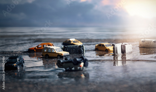 Scene of cars (miniature, toy model ) in flood from natural disasters,heavy rain, typhoon, hurricane.Transportation,Car insurance concept background. © chokchaipoo