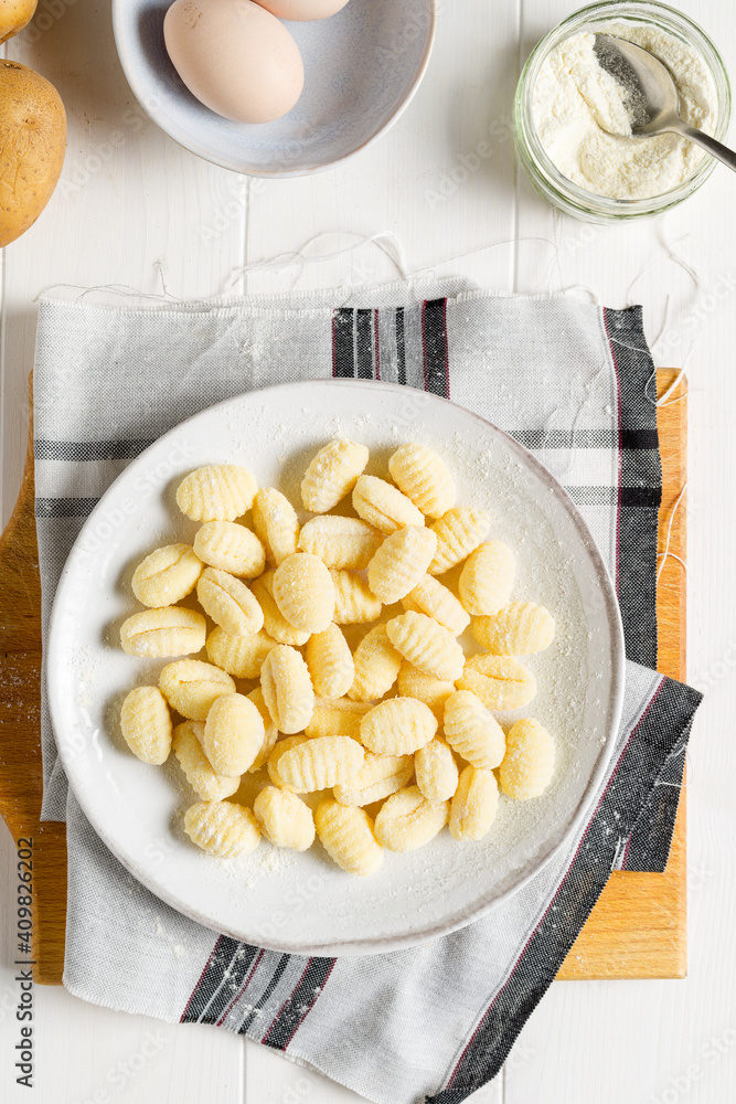 Raw uncooked potato gnocchi with flour. Raw uncooked potato gnocchi with flour.