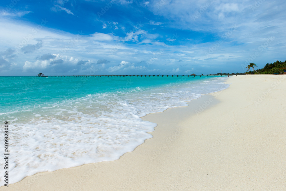 Fototapeta premium tropical Maldives island with white sandy beach and sea