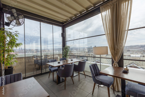 Interior of an empty restaurant with a view © rilueda