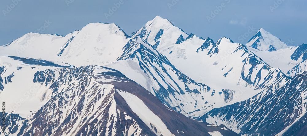 Fototapeta premium Panoramic mountain view. Snow-capped peaks and glaciers.