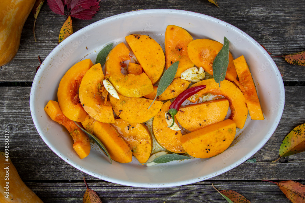 pumpkin with herbs and spices in a baking dish pumpkin with herbs and spices in a baking dish