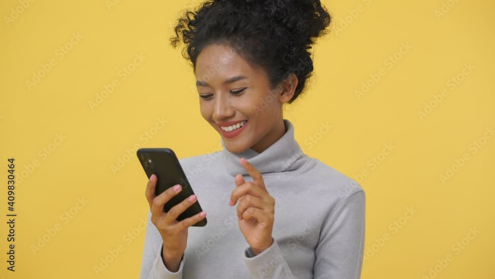 Young woman using smart phone mobile cell phone typing sms message Young woman using smart phone mobile cell phone typing sms message
