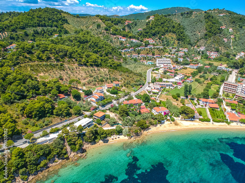 Aerial view over southern skiathos island, Greece with modern hotels and luxurious villas in Sporades, Greece, © panosk18