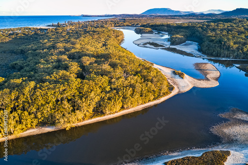 aerial of Australian coastal lake in the rainforest