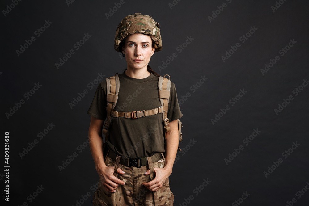 Confident young military woman wearing comouflage Confident young military woman wearing comouflage
