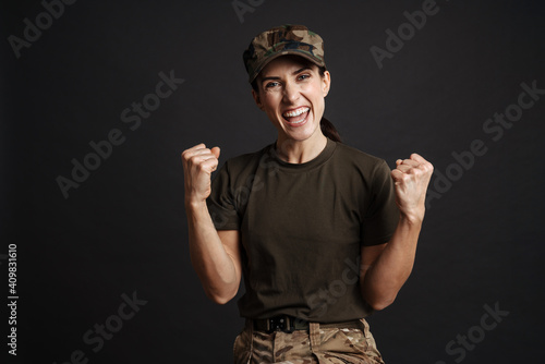 Caucasian female soldier rejoicing her success