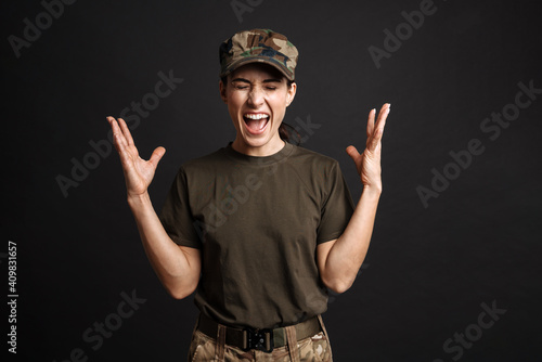 Caucasian female soldier rejoicing her success