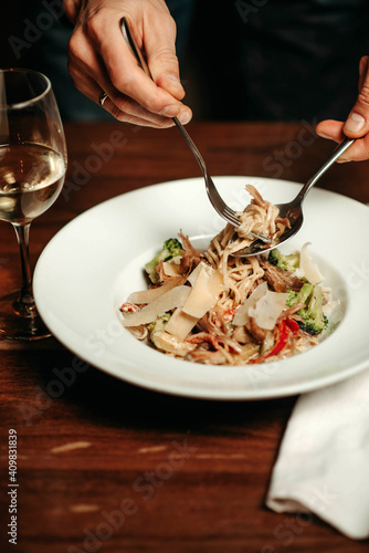 Italian pasta with vegetables and cheese in the restaurant