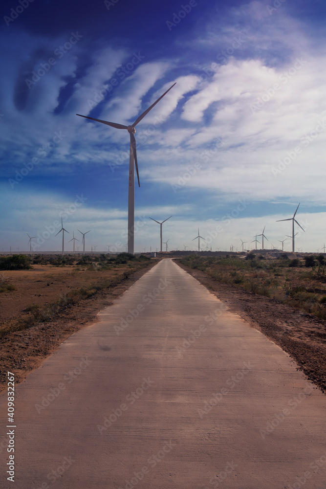 Sunset view of wind power plant. Vast turbine wind mills farm at jhimpir Sunset view of wind power plant. Vast turbine wind mills farm at jhimpir