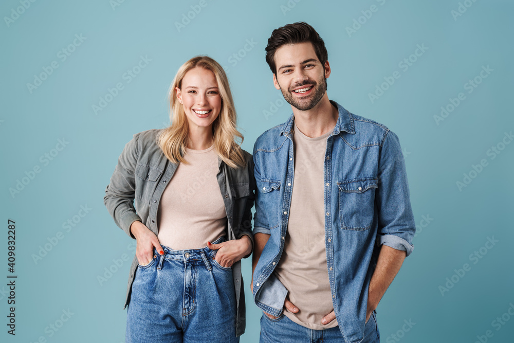 Young beautiful caucasian man and woman smiling and posing at camera Young beautiful caucasian man and woman smiling and posing at camera