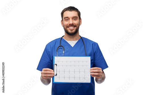 healthcare, profession and medicine concept - happy smiling doctor or male nurse in blue uniform with cardiogram on clipboard over white background © Syda Productions