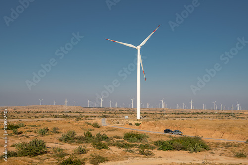 Sunset view of wind power plant. Vast turbine wind mills farm at jhimpir photo