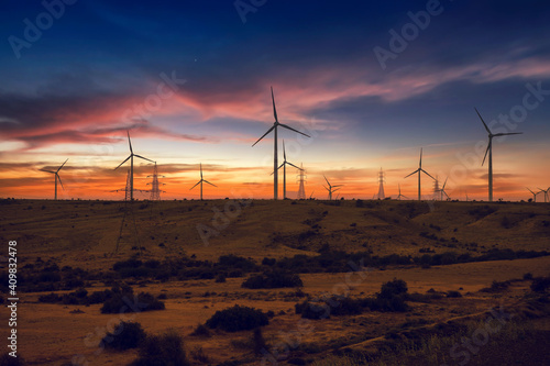 Sunset view of wind power plant. Vast turbine wind mills farm at jhimpir