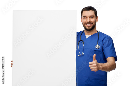 healthcare, profession and medicine concept - happy smiling male doctor or nurse in blue uniform with big board showing thumbs up over white background