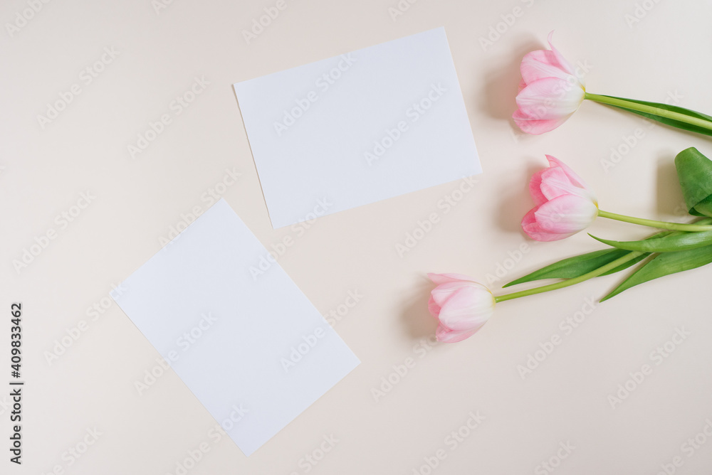 Beautiful composition spring flowers. Blank frame for text, pink tulips flowers on beige background. Valentine's Day, Easter, Birthday, Happy Women's Day. Flat lay, top view, copy space Beautiful composition spring flowers. Blank frame for text, pink tulips flowers on beige background. Valentine's Day, Easter, Birthday, Happy Women's Day. Flat lay, top view, copy space