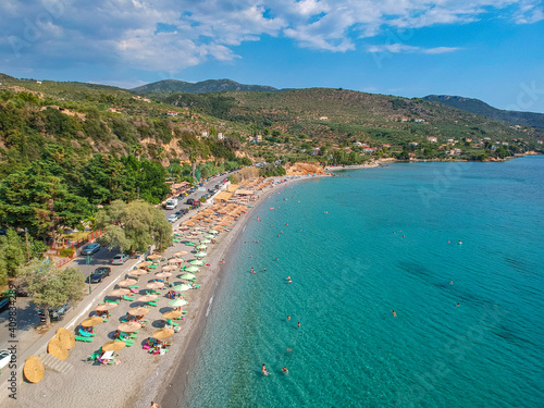Aerial view over Santova coastal area in Messinia, Greece. Summer scenery with beautiful seaside bars and tourists in Santova near Kalamata city, Greece