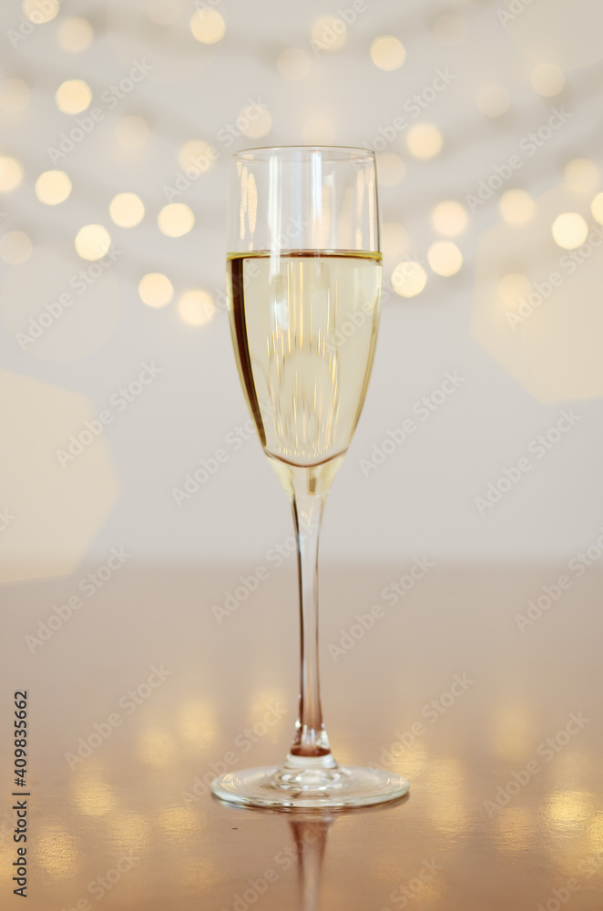 Glass of wine with bokeh background close up. Flat lay. New Year, Christmas mood. Greeting card. Party and holiday celebration concept. Glass of wine with bokeh background close up. Flat lay. New Year, Christmas mood. Greeting card. Party and holiday celebration concept.