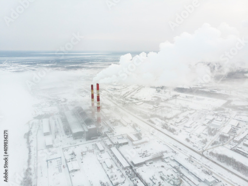 A huge factory chimney with white smoke. Ecology and environment 