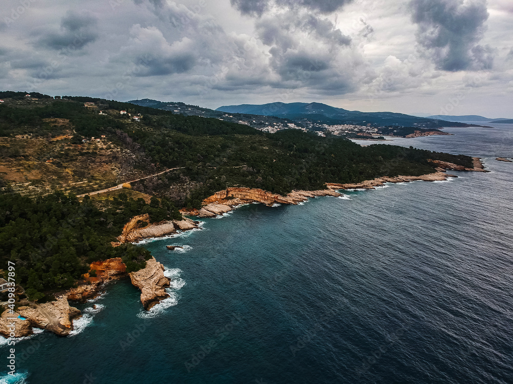 Fototapeta premium Aerial view over western Alonnisos island and the rock formation. Natural landscape, beautiful Greek scenery, spectacular view in Sporades, Aegean sea, Greece