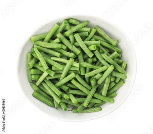 Fresh green beans in bowl isolated on white, top view