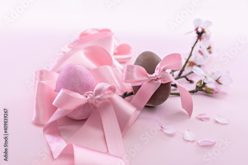 Easter eggs with pink ribbon and cherry blossoms © JeanPaul
