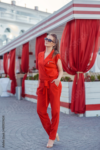 Beautiful young blonde woman in red dress and sunglasses outdoor street fashion portrait © strekozza77