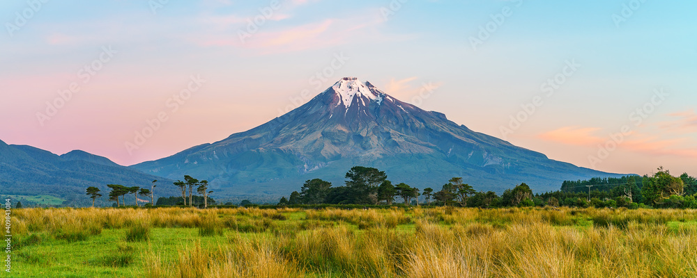 sunset at cone volcano mount taranaki, new zealand