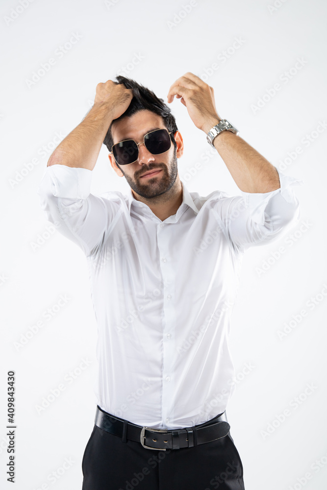 Fototapeta premium Portrait handsome Caucasian man wearing sunglasses standing hair style on white background.