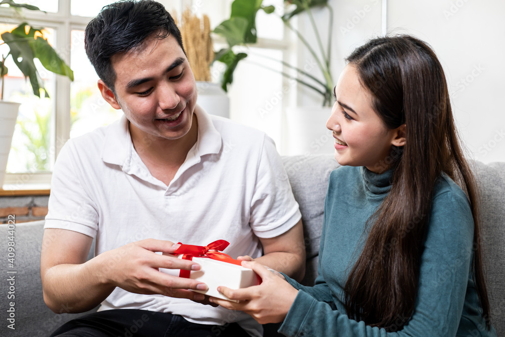 Man surprises his girlfriend with gift box. Man surprises his girlfriend with gift box.