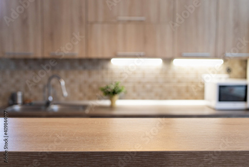 blurred kitchen interior and wooden desk space home background © Melinda Nagy