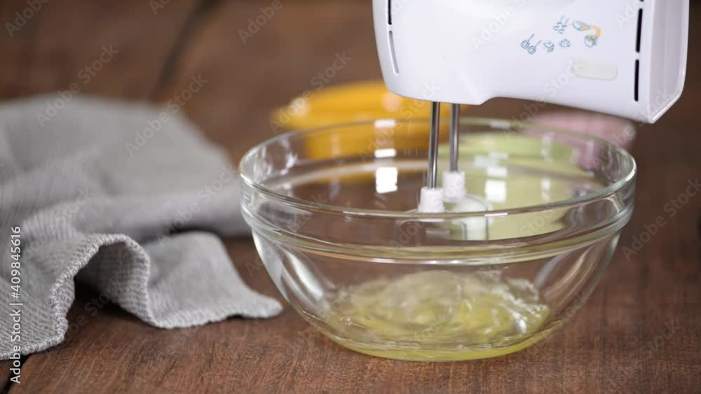 Beating A Egg Whites With A Mixer In A Glass Bowl. Beating A Egg Whites With A Mixer In A Glass Bowl.