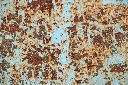 Blue rusty sheet of metal. Brown color, front view. Dirty.