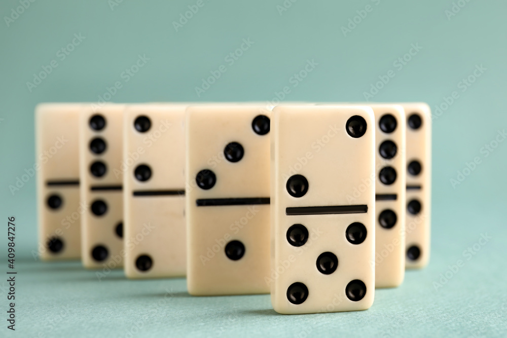 Classic domino tiles on grey background, closeup Classic domino tiles on grey background, closeup
