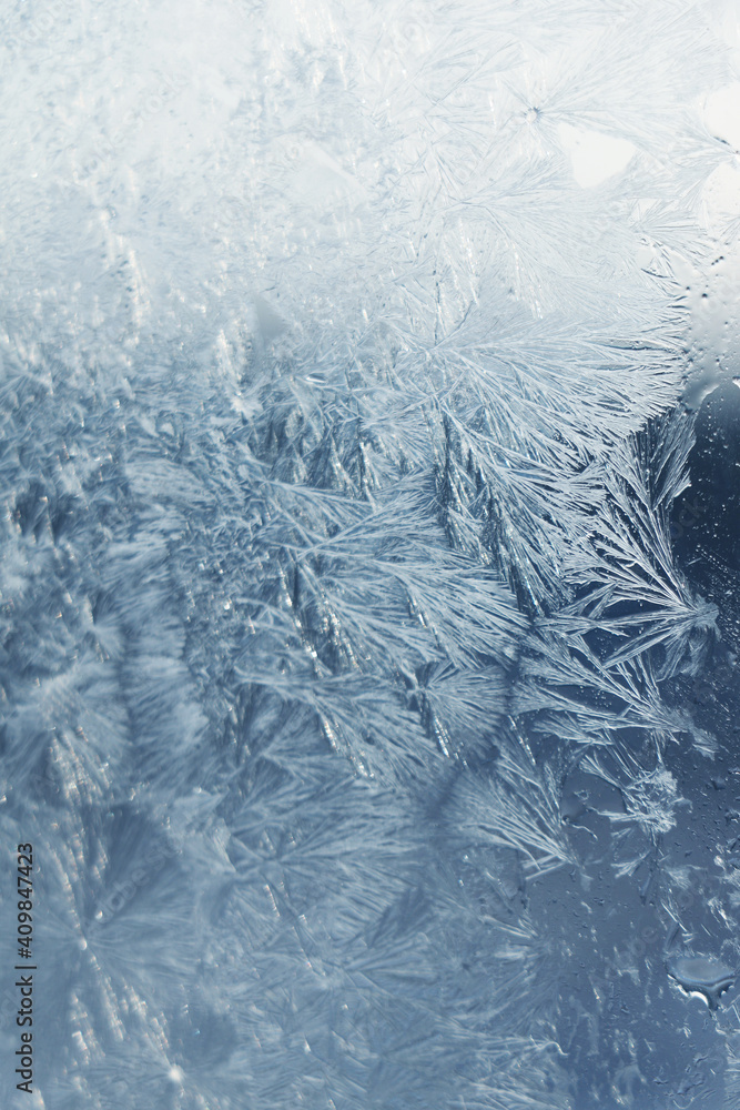 Fototapeta premium Beautiful frosty window as background, closeup. Winter morning