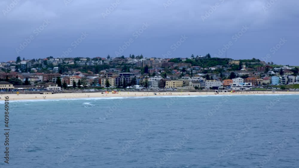 A wide shot of an empty Bondi Beach on a rainy day. A wide shot of an empty Bondi Beach on a rainy day.