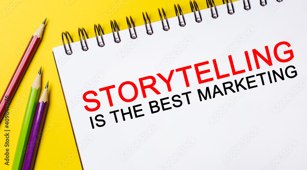 Text Storytelling is the best marketing on a white notepad with pencils on a yellow background. Business concept Text Storytelling is the best marketing on a white notepad with pencils on a yellow background. Business concept