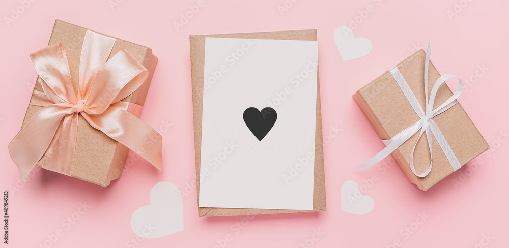 Gifts with note letter on isolated pink background, love and valentine concept with heart Gifts with note letter on isolated pink background, love and valentine concept with heart