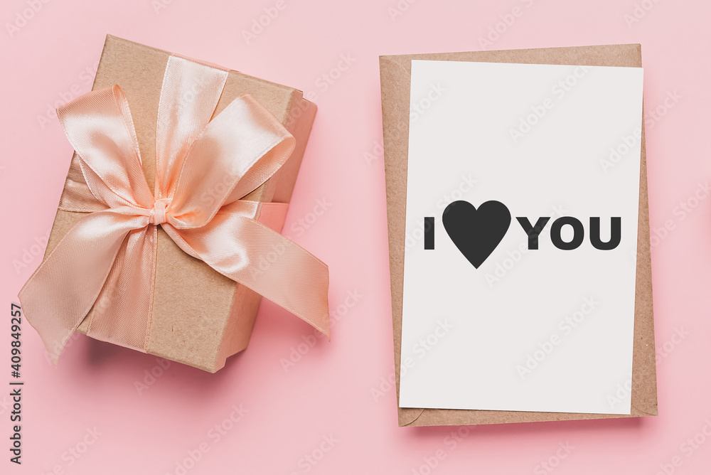 Gifts with note letter on isolated pink background, love and valentine concept with text I love you