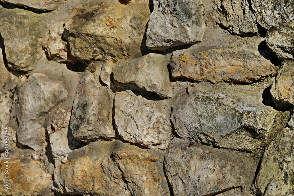 Fototapeta premium Masonry stone wall. Masonry Stone Wall Rock Construction Pattern.