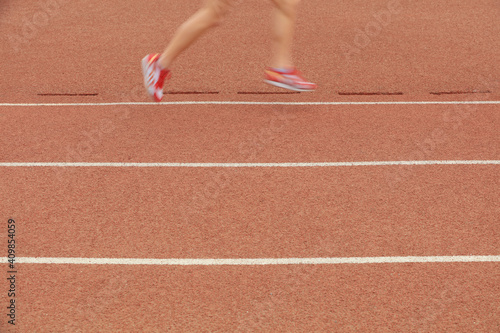 Long distance runners are running on the track