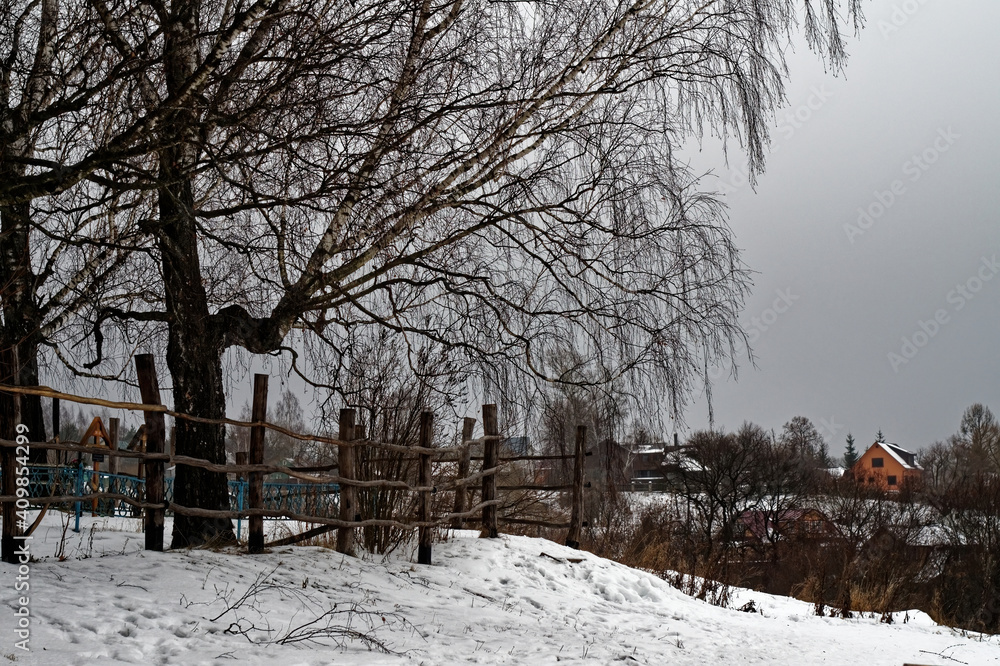 wooden cemetery fence in winter wooden cemetery fence in winter