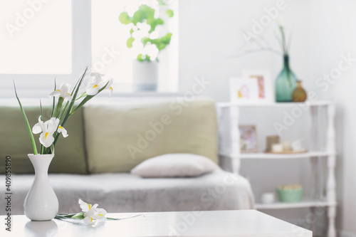 white home interior with spring flowers and decorations