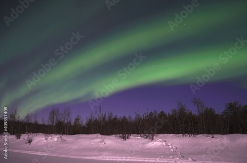 aurora borealis, northern light on winter night sky in northern Norway