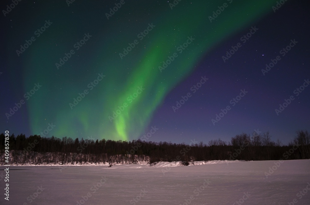 aurora borealis, northern light on winter night sky in northern Norway