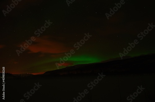 aurora borealis, northern light on winter night sky in northern Norway