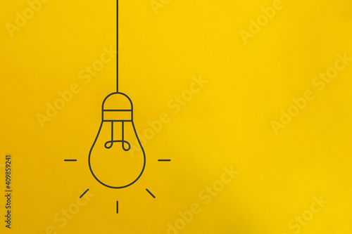 Line Art Bulb Drawing on Bright Yellow Background. photo