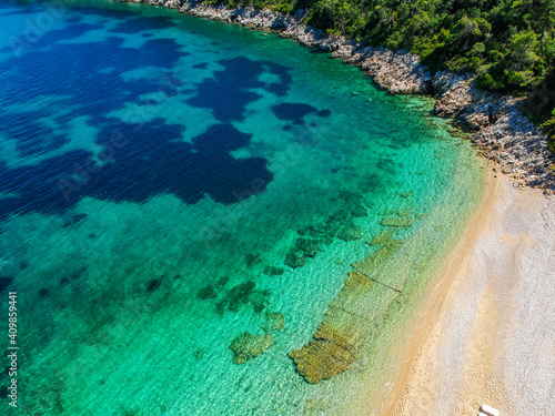 Aerial view over Leftos Gialos beach in Alonnisos island, Sporades, Greece © panosk18