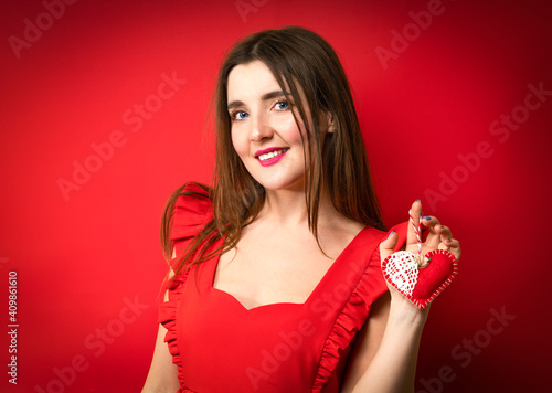 Mothers day holiday. Tradition celebrate valentines day. Sincere love. Be my valentine. Family love. girl with heart. girl with long hair red background. Celebrate valentines day.